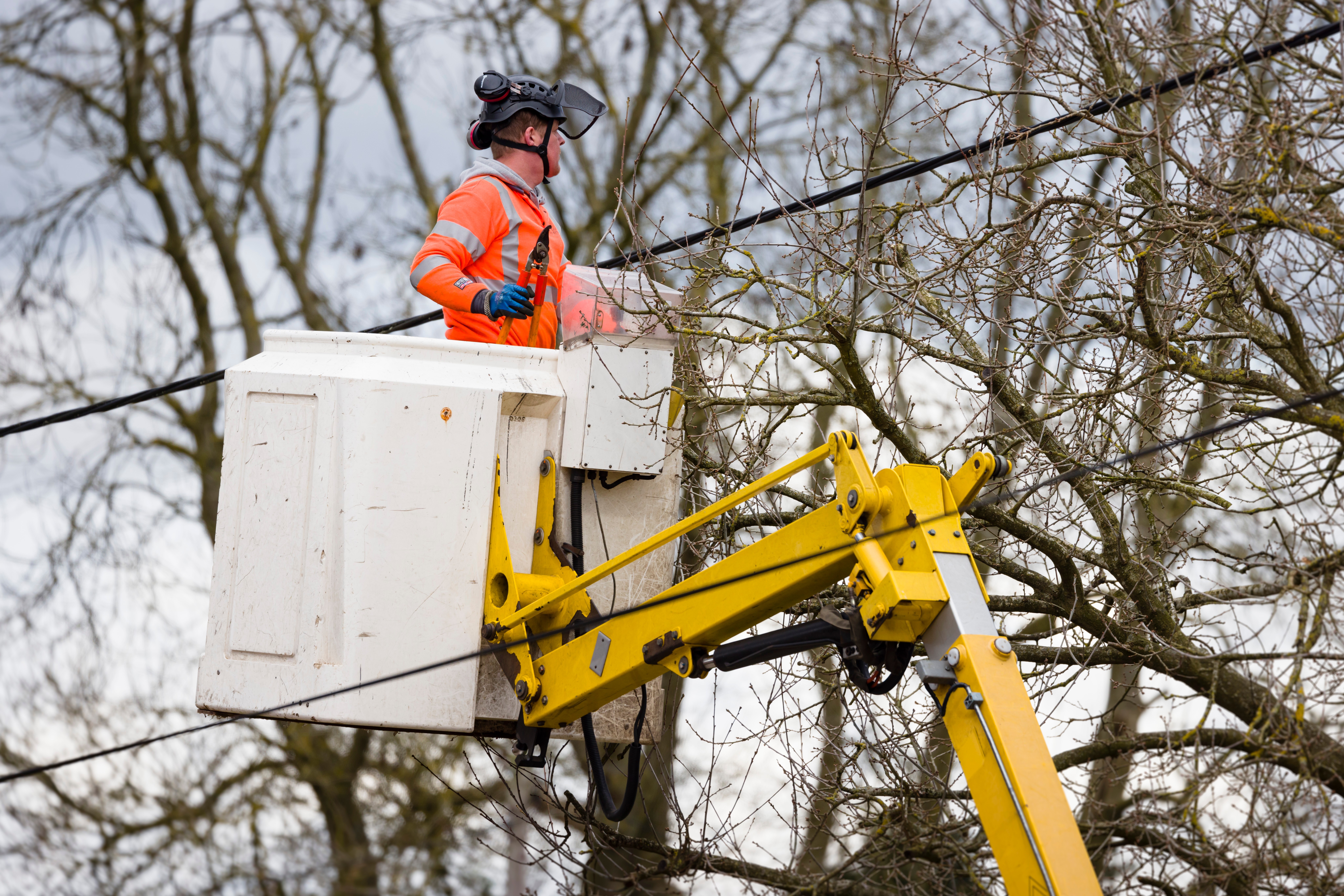 Buckingham, Uk – March 25, 2021. Utility Worker In A Cherry Pick